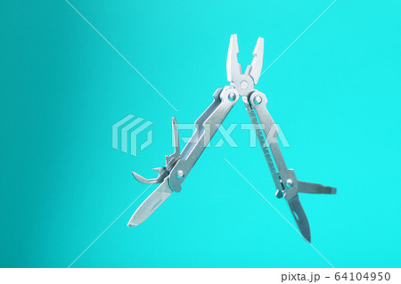 The multitool multi-function tool hovers on a blue 64104950
