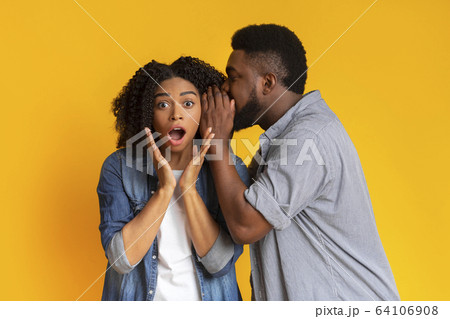 Hot Gossip. Black Guy Sharing Secret With His Shocked Girlfriend 64106908