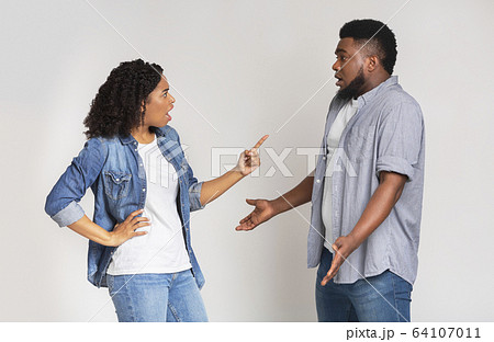 Misunderstanding in relationship. Furious black woman blaming her boyfriend 64107011