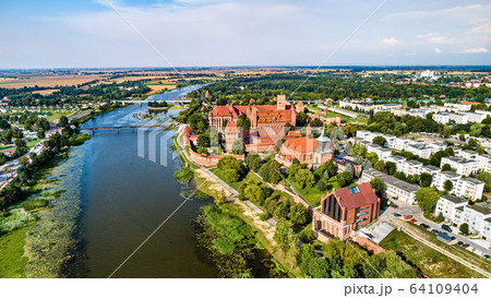 Malbork Castle on the bank of the Nogat River. UNESCO world heritage in Poland 64109404