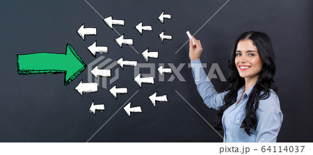 Arrow going in the opposite direction with young woman 64114037