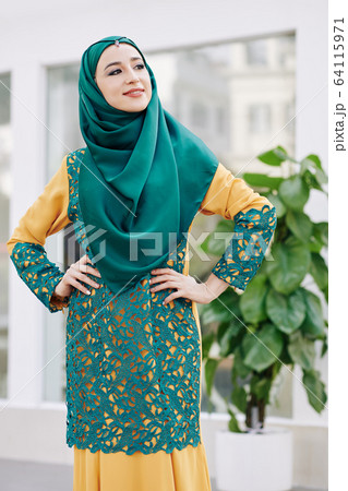 Confident smiling muslim woman 64115971