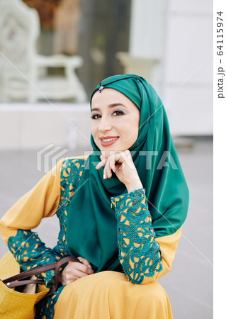 Smiling young muslim woman 64115974