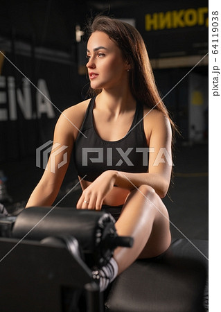 Young brunette in a gym portrait 64119038
