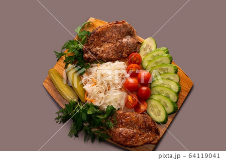 Meat steak with vegetables and salad view 64119041