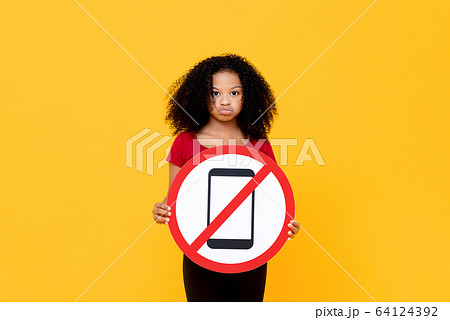Mixed race African girl showing no mobile phone sign Mixed race African girl showing no mobile phone sign 64124392