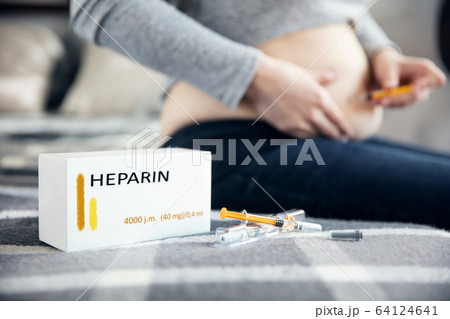 Syringes with medicine and a box with "heparin" Syringes with medicine and a box with "heparin" 64124641