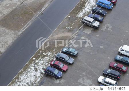 Parking in the courtyard view from above. Courtyard parking in winter. Parking in the courtyard view from above. Courtyard parking in winter. 64124695