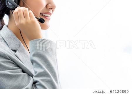 Smiling woman call center staff on white background 64126899
