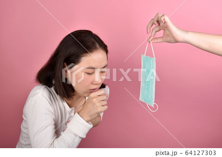 Asian woman have sore throat allergy and coughing Asian woman have sore throat allergy and coughing 64127303