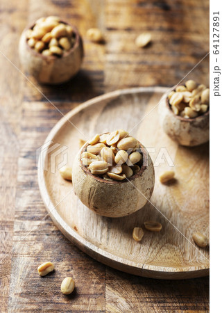 Salt peanut on the wooden table Salt peanut on the wooden table 64127891