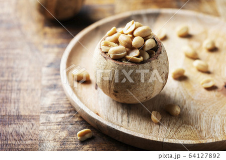 Salt peanut on the wooden table Salt peanut on the wooden table 64127892
