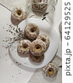 Iced homemade gingerbreads on a white plate in light pastel tones 64129525