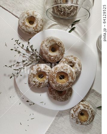 Iced homemade gingerbreads on a white plate in light pastel tones Iced homemade gingerbreads on a white plate in light pastel tones 64129525