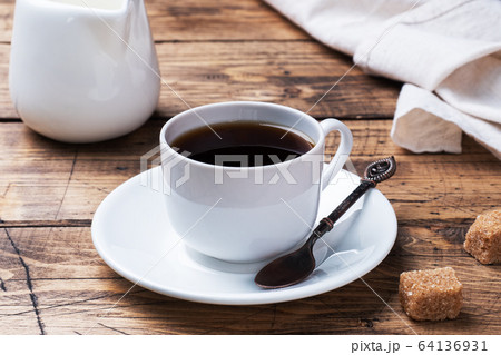 Cup of black coffee and milk on a wooden 64136931
