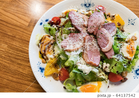 Duck breast salad, including vegetables, fruits, eggs. 64137542