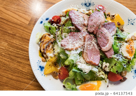 Duck breast salad, including vegetables, fruits, eggs. Duck breast salad, including vegetables, fruits, eggs. 64137543