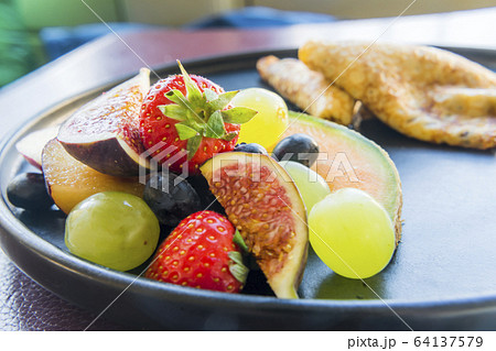 Mixed Fruit for Breakfast on a plate Mixed Fruit for Breakfast on a plate 64137579