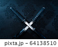 Two katanas with partially drawn blades on fabric 64138510