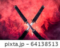 Partially drawn blades of two katanas in red smoke 64138513