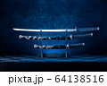 Three swords on stand, katana blade exposed, blue 64138516