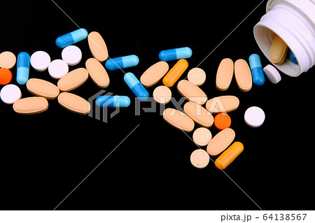 Pills, capsules, drugs isolated on black background. 64138567