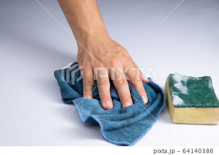washing white acrylic sheet by bare hand and blue rag sponge foam on white background stock photo 64140386