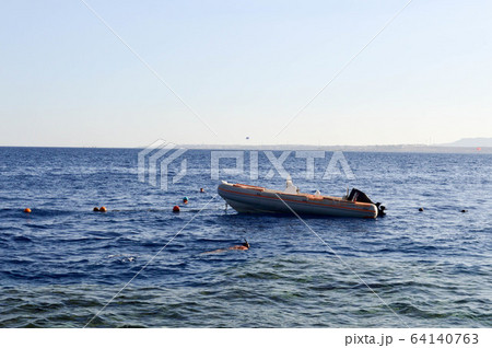 The inflatable gray fast boat, a motor boat  64140763