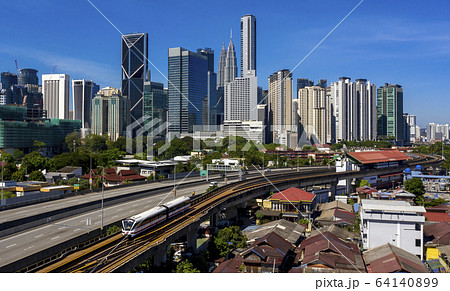 Kuala lumpur city skyline with blue sky 64140899