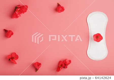Sanitary pad on a pink background with a red flower on top, with a border of flowers for text and images. Free space. Sanitary pad on a pink background with a red flower on top, with a border of flowers for text and images. Free space. 64142624