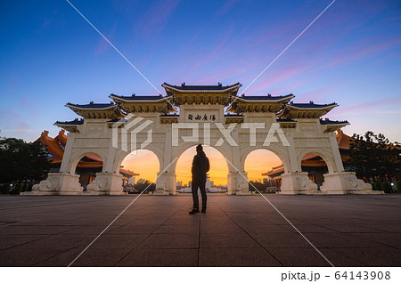 Young man traveller standing in front of Chiang Kai-shek Memorial Hall 64143908