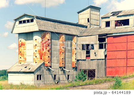Grain processing plant left in the village 64144189