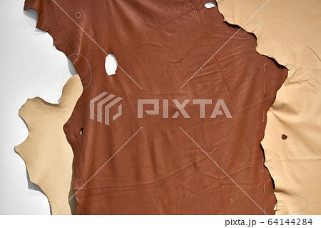Top view at brown and beige large pieces of leather Top view at brown and beige large pieces of leather 64144284