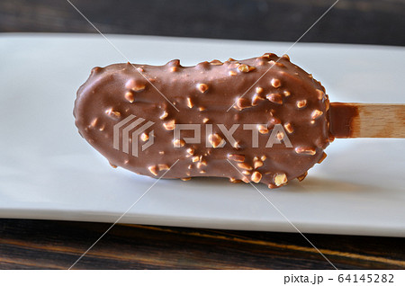 Chocolate-covered vanilla ice cream bar 64145282