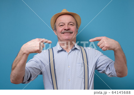 Senior proud man pointing finger himself. Richly and success concept. 64145688