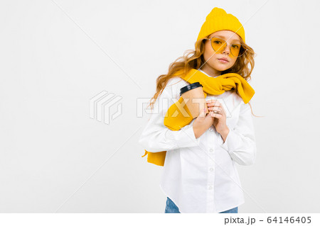 Closeup portrait of a teenage girl with a cup of coffee on a white isolated background with copy Closeup portrait of a teenage girl with a cup of coffee on a white isolated background with copy 64146405
