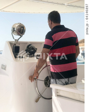 A swarthy captain, an Arab man in a red A swarthy captain, an Arab man in a red 64146897