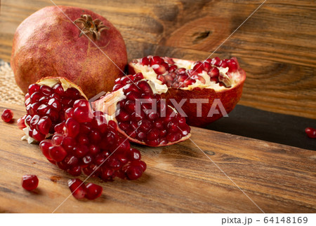Fresh Ripe Organic Pomegranate Fruit with Juicy Fresh Ripe Organic Pomegranate Fruit with Juicy 64148169