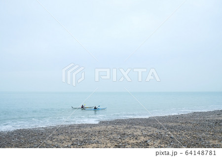 Two people Kayaking in the sea Two people Kayaking in the sea 64148781