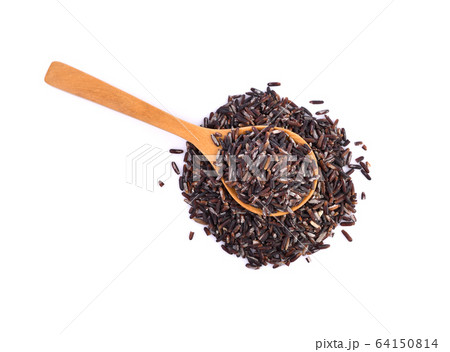 brown rice on wooden spoon on white background. brown rice on wooden spoon on white background. 64150814