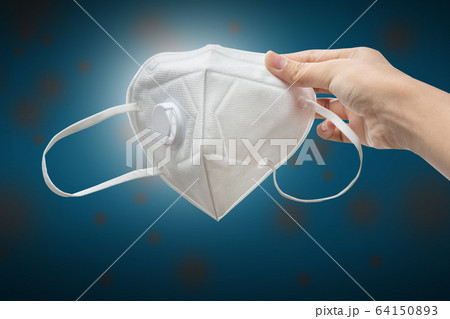 close-up - hand holding N95 mask to protect corona virus, bacteria, dust close-up - hand holding N95 mask to protect corona virus, bacteria, dust 64150893