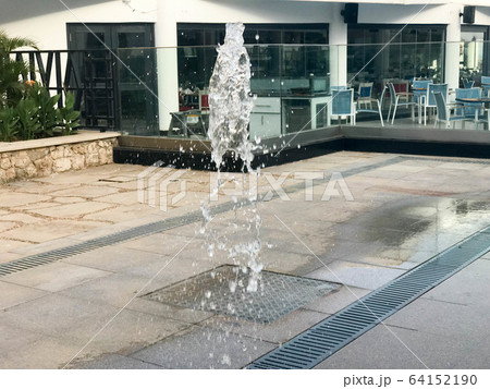 A small beautiful singing fountain in the open  64152190