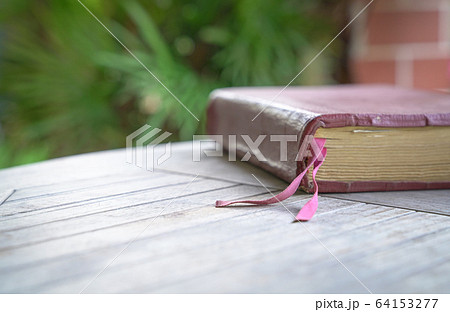 Holy Bible with brown color cover on the wood 64153277