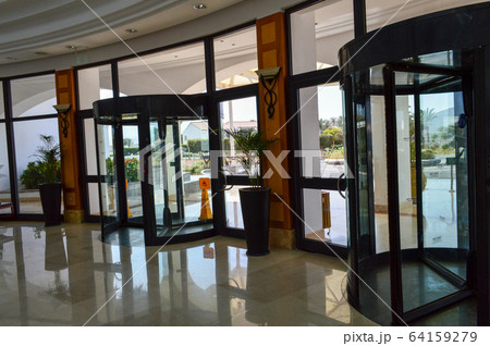A revolving glass door to the shopping center A revolving glass door to the shopping center 64159279