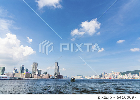 City skyline view of Tsim Sha Tsui across Victoria Harbour with city lights of Hong Kong Cultural Center, Clock Tower and Star Ferry piers City skyline view of Tsim Sha Tsui across Victoria Harbour with city lights of Hong Kong Cultural Center, Clock Tower and Star Ferry piers 64160697