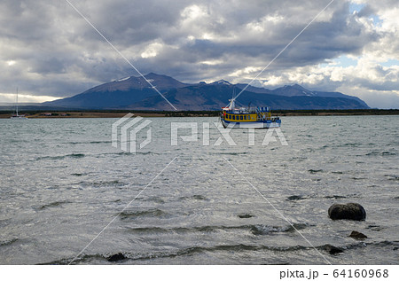 Tourist boat in the Ultima Esperanza Inlet from Puerto Natales. Tourist boat in the Ultima Esperanza Inlet from Puerto Natales. 64160968