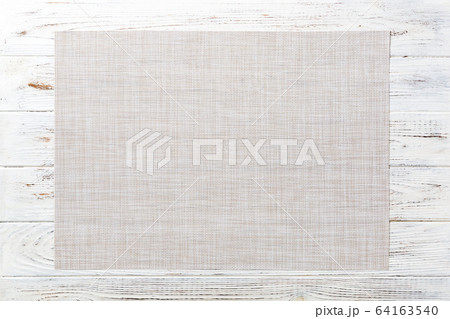 Top view of empty white tablecloth on wooden Top view of empty white tablecloth on wooden 64163540