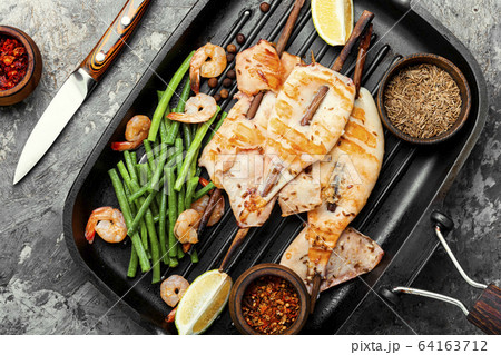 Grilled squid on a skewer 64163712