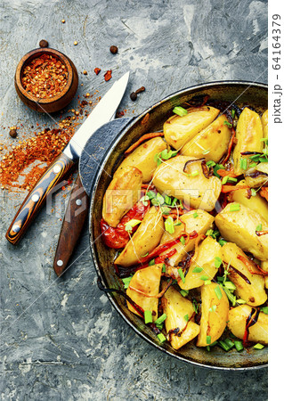 Baked fried potatoes Baked fried potatoes 64164379