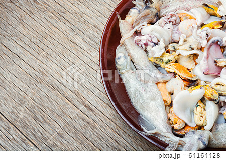 Fresh seafood on stone table Fresh seafood on stone table 64164428